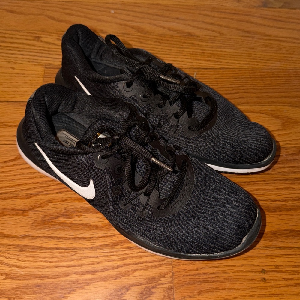 Nike women’s Black Athletic Running Shoes with White Swoosh